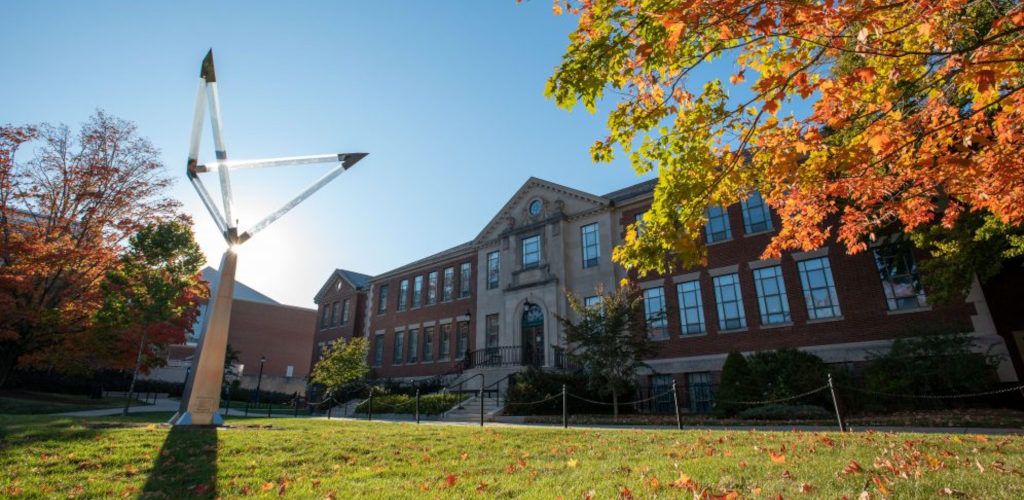 front castleman building in the fall season with leaves on the grass