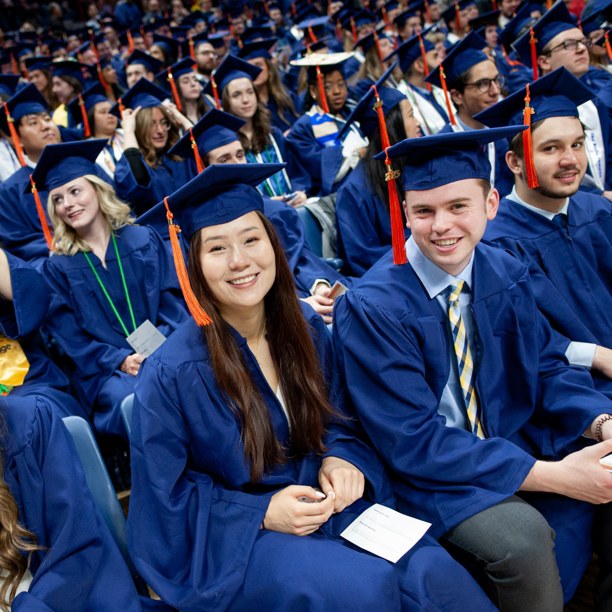 may 2023 commencement of graduates sitting in gampel