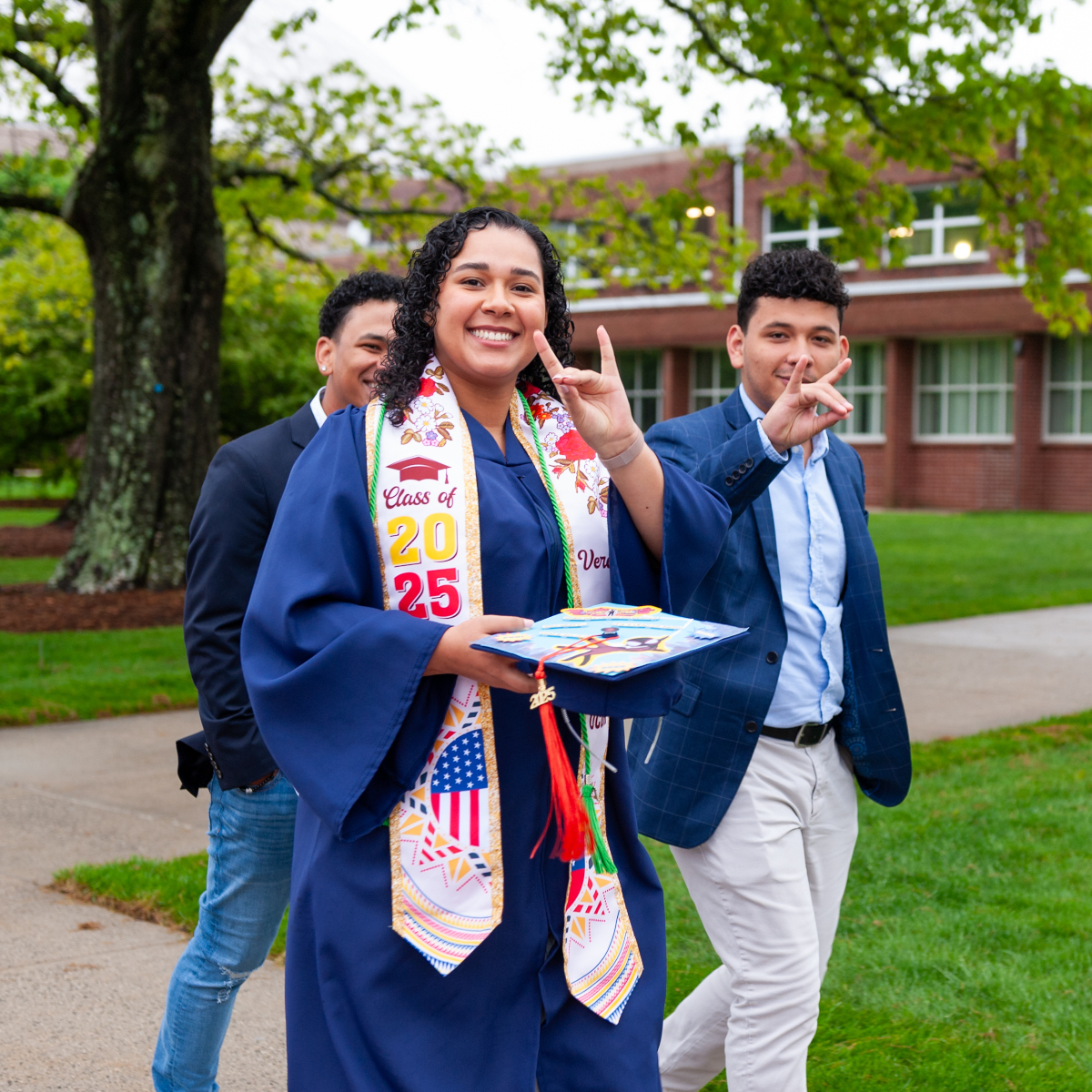 may 2025 commencement female student with guests